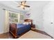 Cozy bedroom with wood floors, natural light, and neutral walls that create a relaxing atmosphere at 12503 Bronco Dr, Tampa, FL 33626