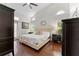 Primary bedroom with wood floors, high ceilings, neutral paint and abundant natural light at 12503 Bronco Dr, Tampa, FL 33626