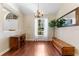 Dining room with wood floors, large window, chandelier, and ample natural light at 12503 Bronco Dr, Tampa, FL 33626