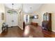 Inviting foyer with dark wood floors, high ceilings, and a front door with sidelights at 12503 Bronco Dr, Tampa, FL 33626