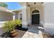 Charming entryway with double front doors, beautiful planters, and decorative pavers at 12503 Bronco Dr, Tampa, FL 33626