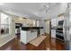 Open kitchen layout with a large island, stainless steel appliances, and wood floors at 12503 Bronco Dr, Tampa, FL 33626