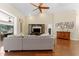 Inviting living room with hardwood floors, high ceilings, and natural light from a nearby window at 12503 Bronco Dr, Tampa, FL 33626