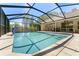 Beautifully designed pool with a screened-in enclosure to relax and enjoy the outdoors at 12503 Bronco Dr, Tampa, FL 33626