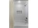 Shower featuring white subway tile and a built in niche at 12503 Bronco Dr, Tampa, FL 33626