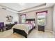 Bedroom with natural lighting and neutral decor at 13312 Waterford Castle Dr, Dade City, FL 33525