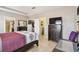 Bedroom showcasing a modern aesthetic with a wooden floor, television and dresser at 13312 Waterford Castle Dr, Dade City, FL 33525