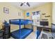 Blue bunk bed in a bedroom with a desk with computer monitor at 13312 Waterford Castle Dr, Dade City, FL 33525