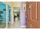 View from the front door showing a colorful interior and hardwood floors at 13312 Waterford Castle Dr, Dade City, FL 33525