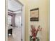 Hallway to bedroom with neutral paint and decor at 13312 Waterford Castle Dr, Dade City, FL 33525