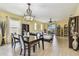 Bright living room and dining area with sliding glass doors to the outdoor patio at 13312 Waterford Castle Dr, Dade City, FL 33525