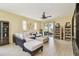 Spacious living room with a ceiling fan, decor lighting, and comfortable seating at 13312 Waterford Castle Dr, Dade City, FL 33525