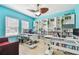 Stylish home office with custom shelving, a modern desk, and ample natural light at 13312 Waterford Castle Dr, Dade City, FL 33525
