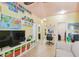 room with colorful learning decor and adjacent work space at 13312 Waterford Castle Dr, Dade City, FL 33525