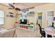 Bright room with alphabet wall decor, ceiling fan, and adjacent bathroom at 13312 Waterford Castle Dr, Dade City, FL 33525
