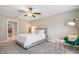 Cozy bedroom featuring a ceiling fan, neutral walls, and comfortable decor at 13419 Willow Bluestar Loop, Riverview, FL 33579