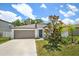 Charming single-story home with a well-manicured lawn and a two-car garage in a sunny neighborhood at 13419 Willow Bluestar Loop, Riverview, FL 33579