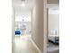 Bright hallway leading to an open living space with a cozy bedroom nook at 13419 Willow Bluestar Loop, Riverview, FL 33579