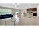 Inviting living space with seamless flow to the modern kitchen, ideal for entertaining and Gathering gatherings at 13419 Willow Bluestar Loop, Riverview, FL 33579
