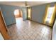 Bedroom featuring tile flooring, neutral walls, and plenty of natural light at 13931 Hatcher Ave, Hudson, FL 34667