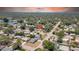 Scenic aerial view showcasing the neighborhood with a nearby lake and lush greenery at 1416 Murray Ave, Clearwater, FL 33755