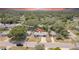 Charming single-story home featuring a well-maintained yard, long driveway, and mature shade trees in a quiet, residential neighborhood at 1416 Murray Ave, Clearwater, FL 33755