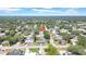 Charming home nestled in a lush, green neighborhood, shown in this inviting aerial view, highlighting its peaceful location at 1416 Murray Ave, Clearwater, FL 33755