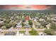 Discover this home nestled in a leafy neighborhood, as captured in a beautiful aerial shot, ideal for serene living at 1416 Murray Ave, Clearwater, FL 33755