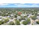 Aerial view showcasing the neighborhood with mature trees and proximity to community amenities at 1416 Murray Ave, Clearwater, FL 33755