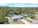 An overhead shot showcases a fenced-in backyard and a well-maintained landscape at 1416 Murray Ave, Clearwater, FL 33755