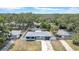 An aerial view capturing the property's fenced backyard and surrounding trees at 1416 Murray Ave, Clearwater, FL 33755