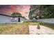 A spacious backyard with a well-maintained lawn and privacy fence at 1416 Murray Ave, Clearwater, FL 33755