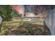 Large fenced backyard with a mature trees providing ample shade at 1416 Murray Ave, Clearwater, FL 33755