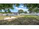 Cozy backyard setting featuring a concrete fountain, patio, and privacy fence under a bright sunny sky at 1416 Murray Ave, Clearwater, FL 33755