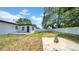 A view of the home's spacious backyard, featuring well-maintained grass and space for activities at 1416 Murray Ave, Clearwater, FL 33755
