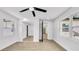 Bright bedroom features wood floors, closet with mirrored doors, and natural lighting at 1416 Murray Ave, Clearwater, FL 33755