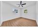 Bedroom featuring modern flooring, neutral walls, and natural light from two windows at 1416 Murray Ave, Clearwater, FL 33755