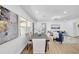 Dining room with a modern table, hardwood flooring, and view to the living room at 1416 Murray Ave, Clearwater, FL 33755