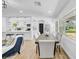 Bright dining area showcasing an open layout with kitchen and living room in the background at 1416 Murray Ave, Clearwater, FL 33755