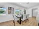 Contemporary dining area with a stylish table setting and plenty of natural light at 1416 Murray Ave, Clearwater, FL 33755
