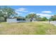 Charming single-story home featuring fresh white paint, black accents and an attached garage at 1416 Murray Ave, Clearwater, FL 33755