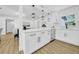 Modern kitchen featuring quartz countertops, shaker cabinets, and stainless steel appliances at 1416 Murray Ave, Clearwater, FL 33755