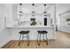 This updated kitchen features stone countertops, a stylish backsplash and modern pendant lighting at 1416 Murray Ave, Clearwater, FL 33755