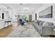 Open living area with hardwood floors, neutral walls, and comfortable seating arrangement at 1416 Murray Ave, Clearwater, FL 33755