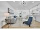 Comfortable living room featuring a cozy couch, stylish side tables, and hardwood floors at 1416 Murray Ave, Clearwater, FL 33755