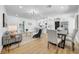Open floor plan featuring a living room, dining area, and modern kitchen with stainless steel appliances at 1416 Murray Ave, Clearwater, FL 33755