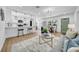 Open-concept living space featuring a modern kitchen, dining area, and stylish living room decor at 1416 Murray Ave, Clearwater, FL 33755