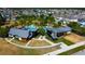 Community clubhouse, swimming pool, and lush green spaces in a beautiful aerial view of the neighborhood at 14975 Renaissance Ave, Odessa, FL 33556