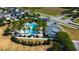 Aerial view showcasing the community pool, clubhouse, and surrounding homes in a well-manicured neighborhood at 14975 Renaissance Ave, Odessa, FL 33556