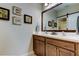 Bathroom featuring double sink vanity and decorative wall art at 14975 Renaissance Ave, Odessa, FL 33556